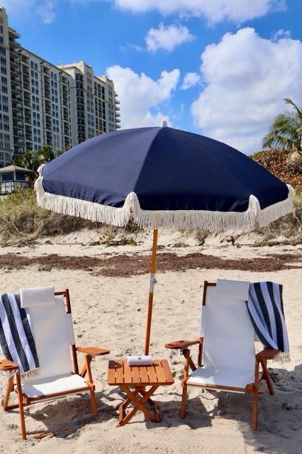 Premium beach day setup with cabana and chairs
